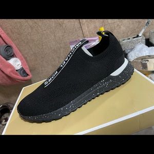 Michael Kors women slip on…